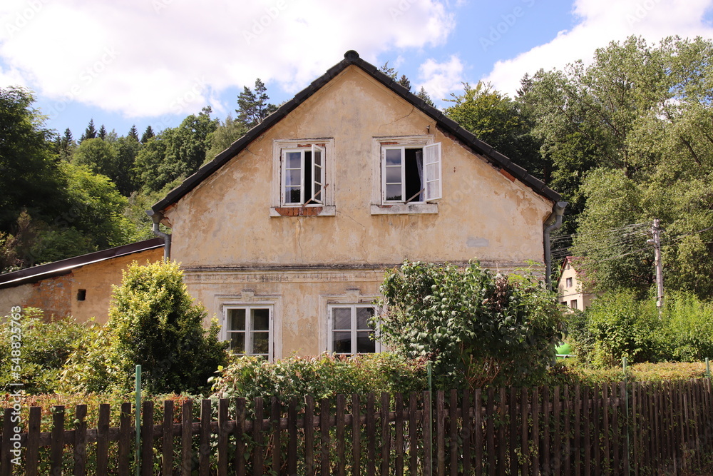 A traditional house with garden and fence in Lusatian mountains at Prysk, Czech republic