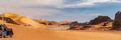Murais de parede Panoramic view of Sahara Desert sand dune and rocky mountain off road nature