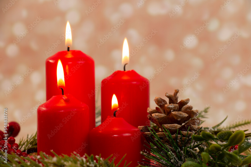 Advent - four red candles with a Christmas ornament. Fourth candle, Angel's candle Advent - four red candles with a Christmas ornament. Fourth candle, Angel's candle