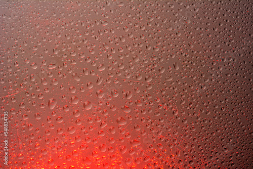 The effect of rain on a colored background.