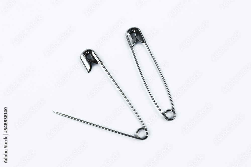 Open and closed safety pins. Safety pin isolated on white background Open and closed safety pins. Safety pin isolated on white background