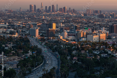 The 101 freeway leading into the downtown Los Angeles skyline at dusk