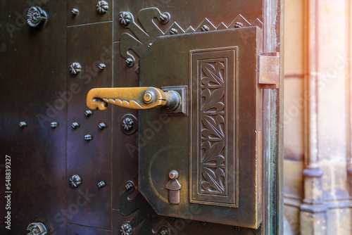 Photography Corner of an open metal street door