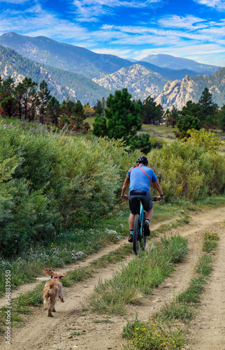 Mountain biker out for a ride with his dog in Colorado