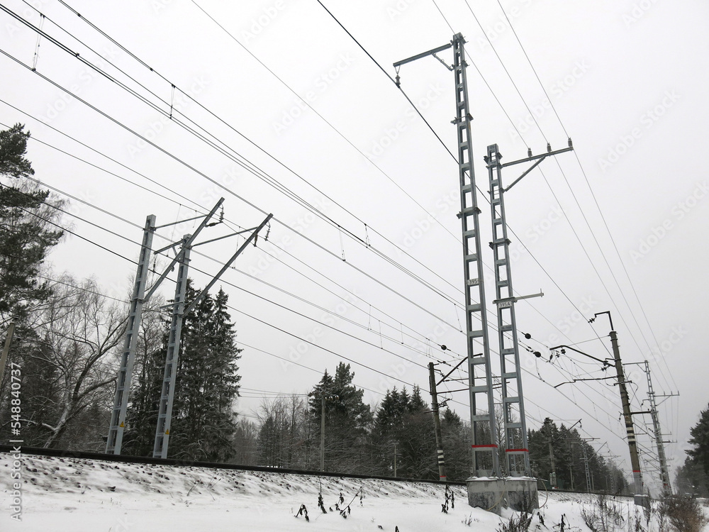 panorama of the Moscow region railway track with towers, wires and rails in winter panorama of the Moscow region railway track with towers, wires and rails in winter