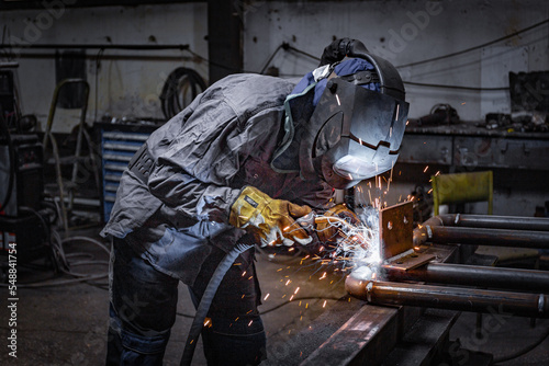 Welder erecting technical steel