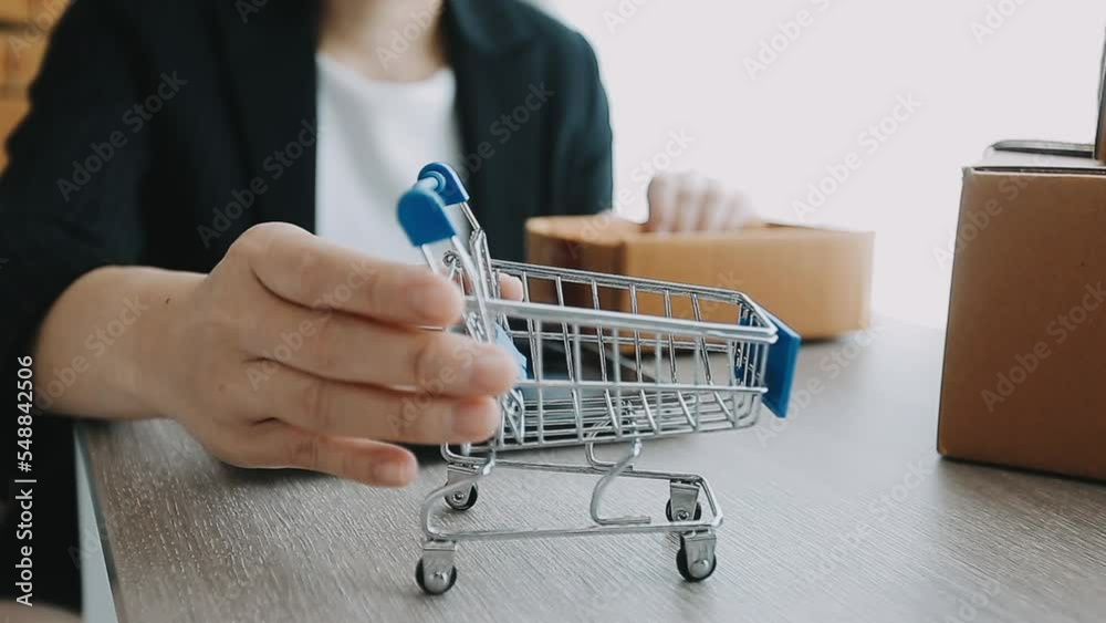 Business woman start up small business entrepreneur SME success .freelance woman working at home with Online Parcel delivery. SME and packaging deliveryconcept Business woman start up small business entrepreneur SME success .freelance woman working at home with Online Parcel delivery. SME and packaging deliveryconcept