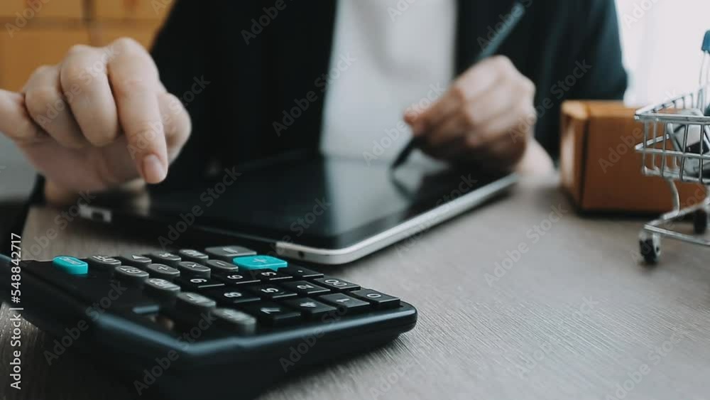 Business woman start up small business entrepreneur SME success .freelance woman working at home with Online Parcel delivery. SME and packaging deliveryconcept Business woman start up small business entrepreneur SME success .freelance woman working at home with Online Parcel delivery. SME and packaging deliveryconcept
