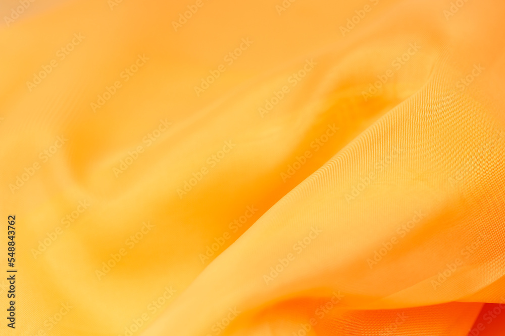 Obraz premium orange silk. wavy fabric for background