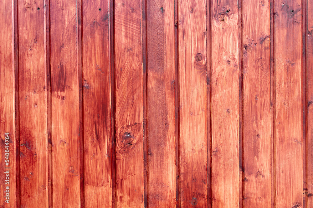 Fence made of wood colored with red paint. Carpentry backdrop with copy space Fence made of wood colored with red paint. Carpentry backdrop with copy space