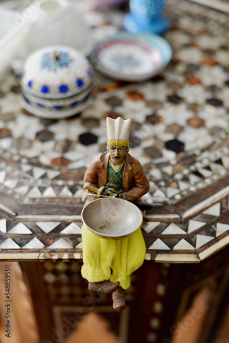 Ottoman warrior figurine placed on top of an antique turkish table photo