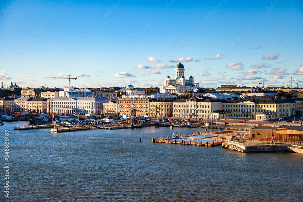 Aerial scenic panoramic view Helsinki city, embankment capital of Finland with blue evening sky. Background of amazing urban scenery view of Scandinavian finnish architecture. Copy text space