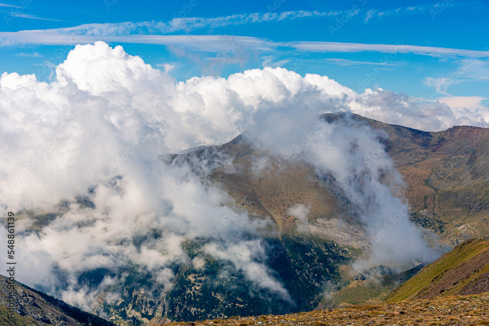 Beautiful white clouds over the mountains