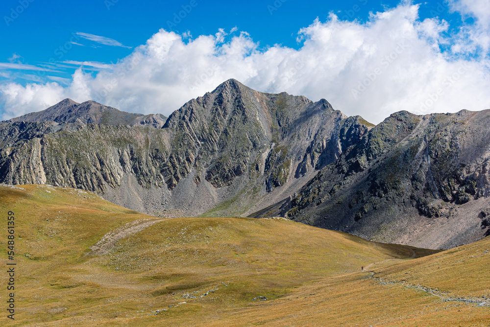 Mountain landscape with blue sky and white clouds