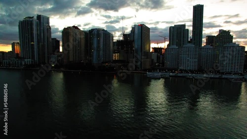 Wallpaper Mural Aerial Shot Of Modern Financial Under Cloudy Sky, Drone Flying Downwards Over Sea At Sunset - Miami, Florida Torontodigital.ca