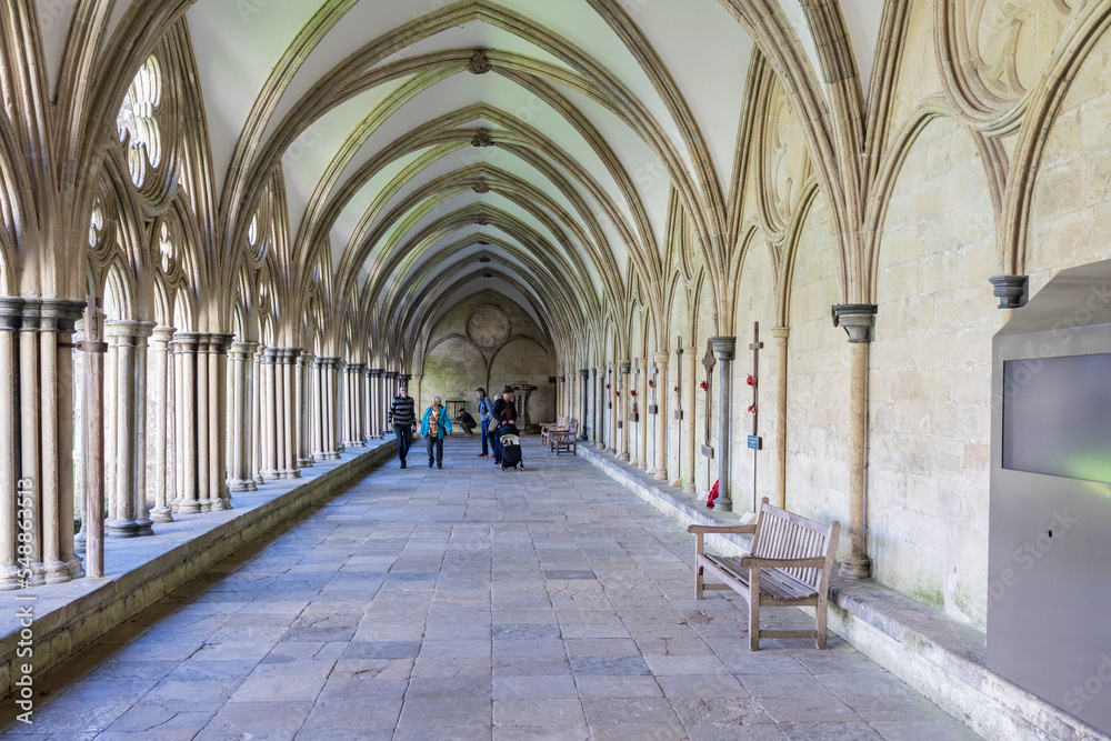 Salisbury Wiltshire, uk, 10, October, 2022 people exploring the external covered walkway of the Salisbury Cathedral Cloisters.