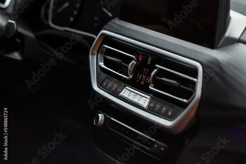 Digital control panel car air conditioner dashboard. Modern car interior conditioning buttons inside a car close up view.