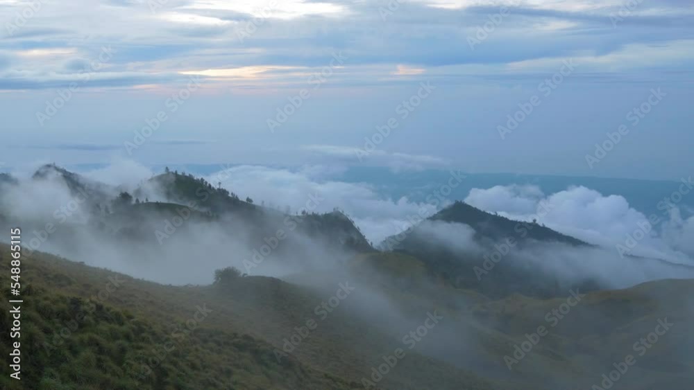 Sea of clouds at sunset over the mountains of Lombok, in Indonesia Sea of clouds at sunset over the mountains of Lombok, in Indonesia