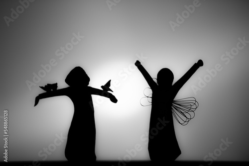 Two angels in silhouette