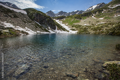 Alpine Lake in Caucasus Mountains photo