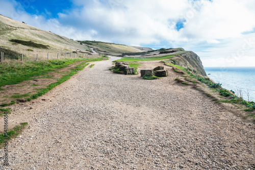 Beautiful views of nature on way to Durdle door in Lulworth, Dorset, United Kingdom. Part of Jurassic Coast World Heritage Site, view of stone formations and sea, selective focus