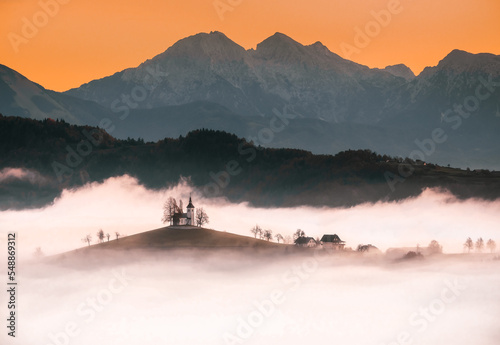 Tomaz, Slovenia: St Thomaz little chapel among fog in the morning