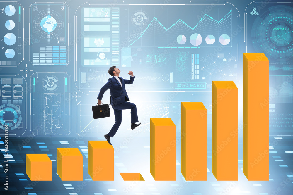 Businessman in growth concept with bar charts Businessman in growth concept with bar charts