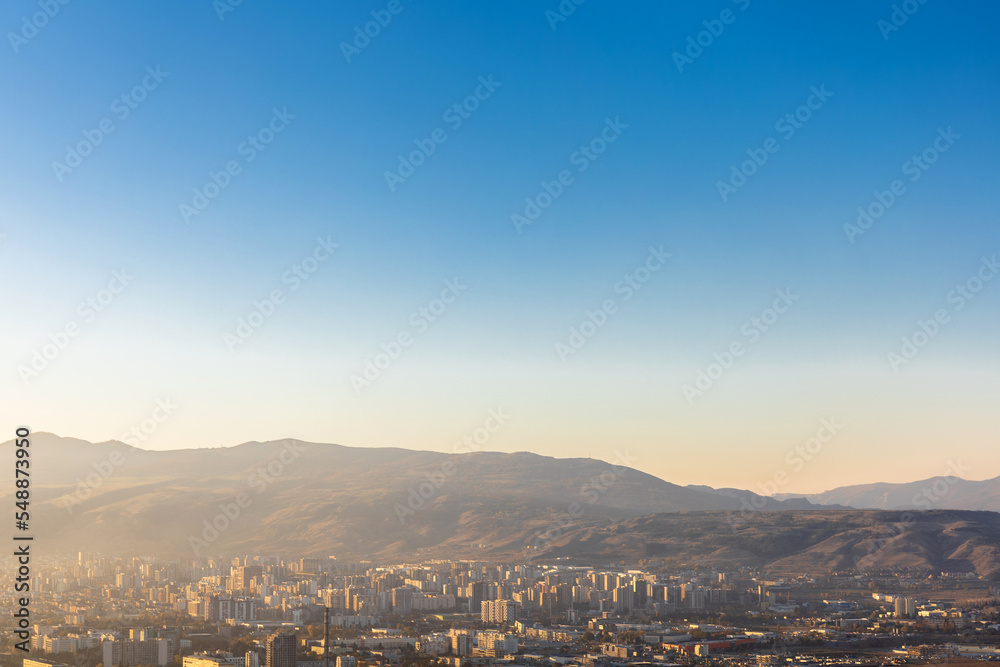 top view of the city at the foot of the mountain