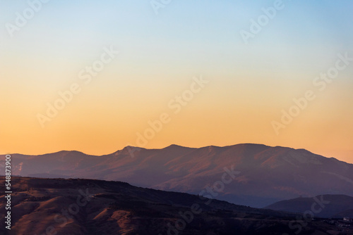 picturesque red mountains at sunset
