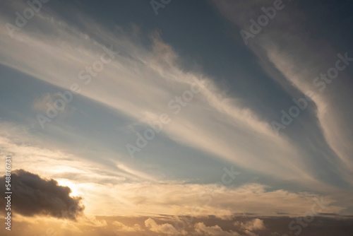 Calm sunset sky with clouds. Nature background for design. © mark_gusev