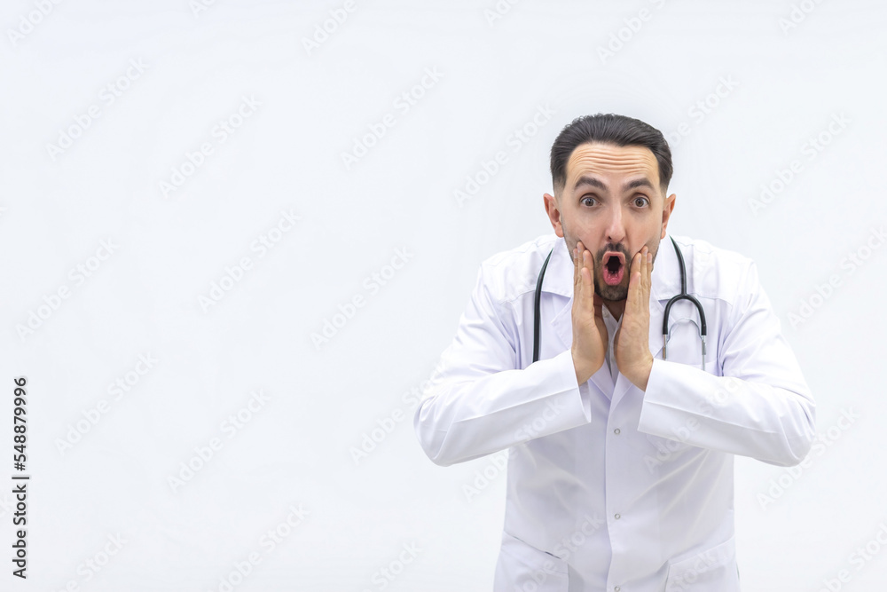 Close up photo of male mature doctor posing at camera with a stethoscope. Close up photo of male mature doctor posing at camera with a stethoscope.