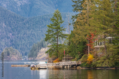 Lakefront residences. Houses on the shore of Indian Arm North Vancouver BC. Peaceful Houses and boats on the Bay