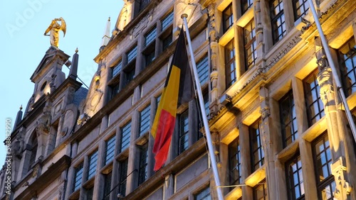 Belgian flag on old houses photo