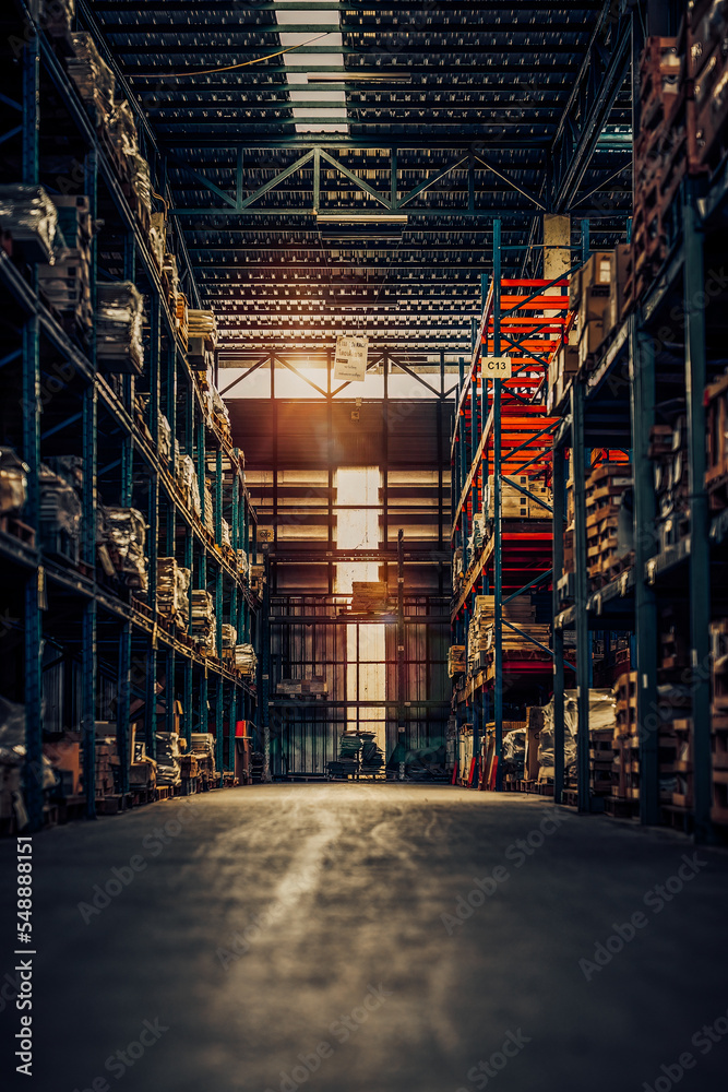 interior of modern retail warehouse storage with pallet trucks near shelves.Concept of warehouse forklifts between rows in a large warehouse. Dark Tone
