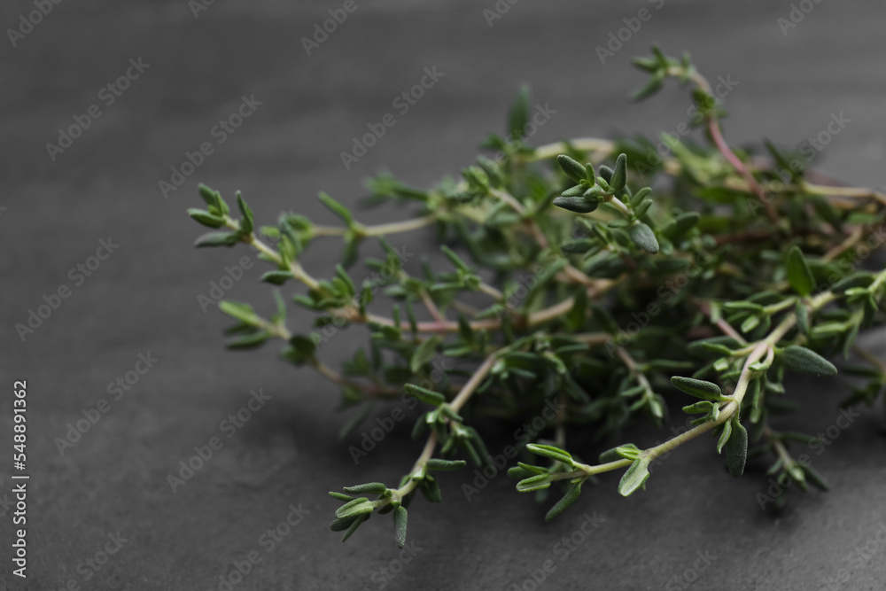 Aromatic fresh thyme on black table, closeup Aromatic fresh thyme on black table, closeup