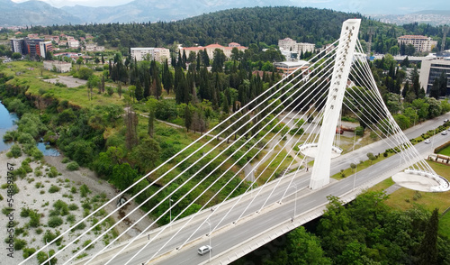 Aerial drone view of cable stayed Millennium bridge and Moraca river in Podgorica, Montenegro.