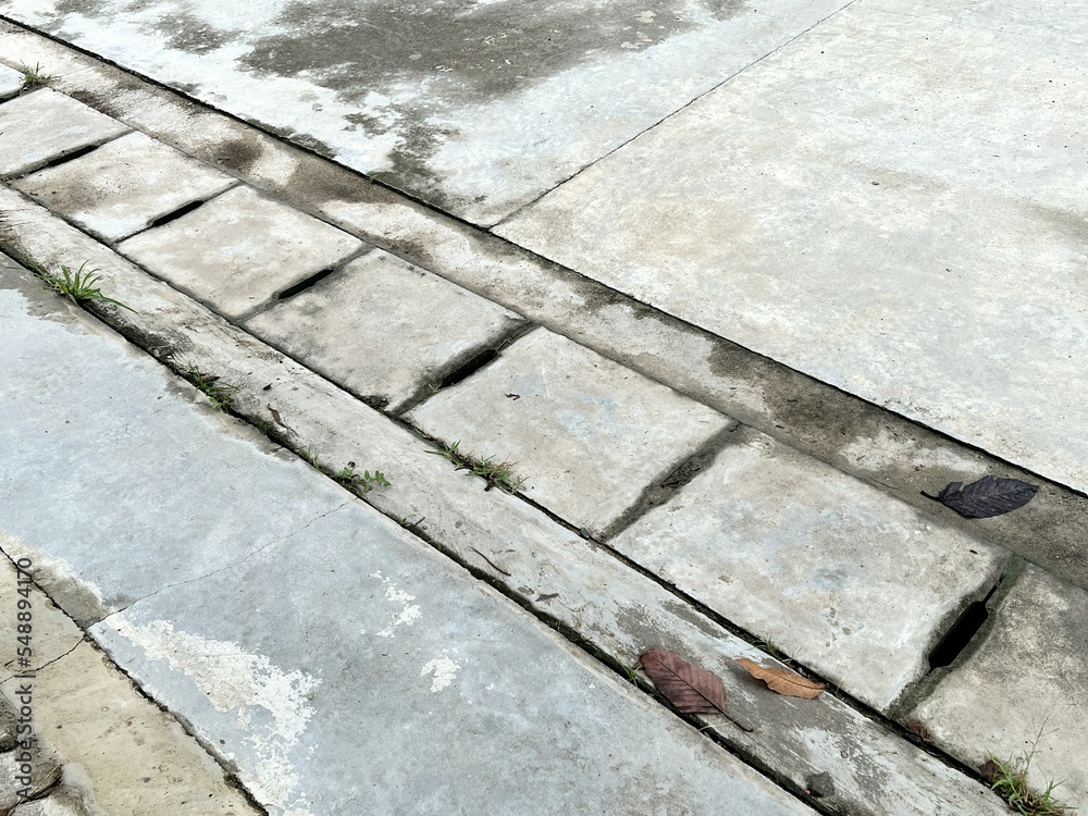 old stone pavement with a lot of concrete tiles