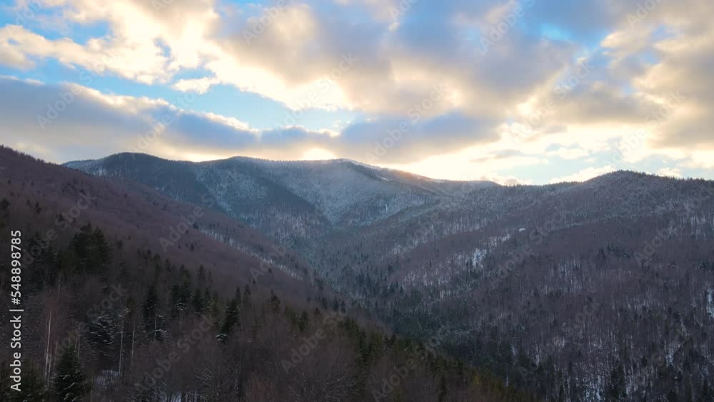 Winter landscape with spruse trees of snow covered forest in cold mountains at sunset Winter landscape with spruse trees of snow covered forest in cold mountains at sunset