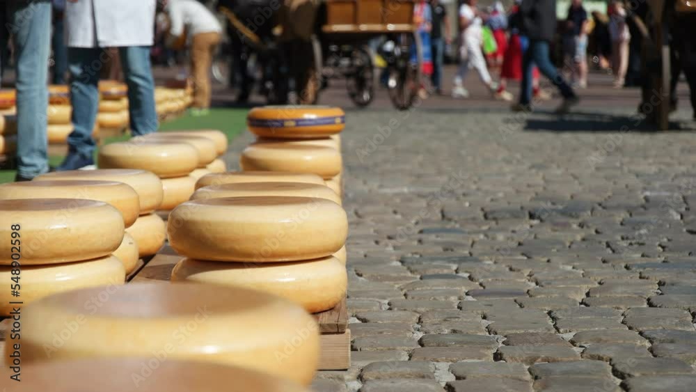 Cheese Wheels Piled Up On The Street At The Famous Cheese Market In Gouda, Netherlands. Close Up Cheese Wheels Piled Up On The Street At The Famous Cheese Market In Gouda, Netherlands. Close Up