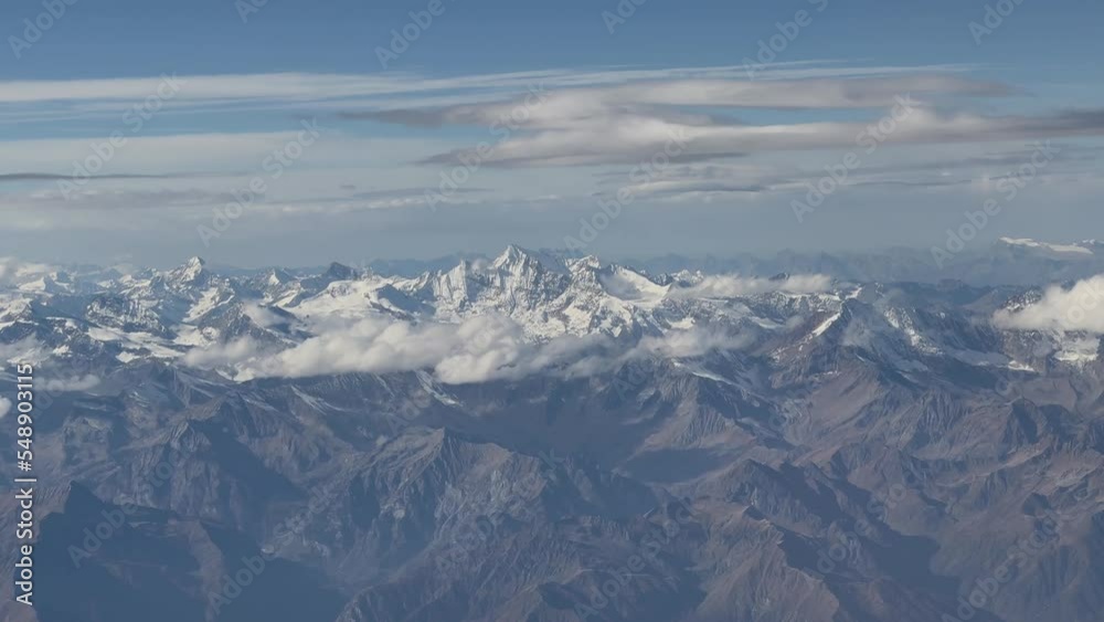 Alps with snow and clouds. Flight over the Alps 4k Alps with snow and clouds. Flight over the Alps 4k