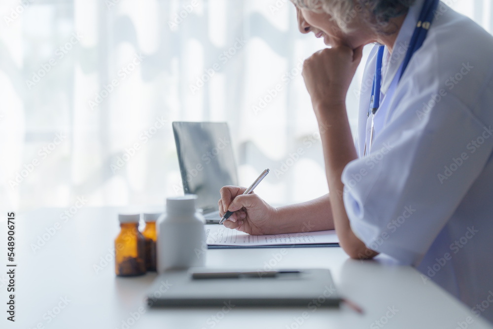 Doctor having conversation with patient while discussing explaining symptom and hold hand for encourage Doctor having conversation with patient while discussing explaining symptom and hold hand for encourage