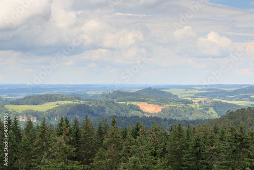 Panorama view of Eifel mountains with castle Kasselburg and trees seen from hill Heiligenstein near Gerolstein, Germany