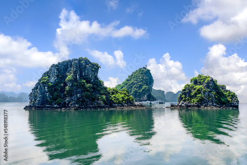 Small mountains rise above the water in Ha Long Bay, Quang Ninh province, Vietnam. © ducvien