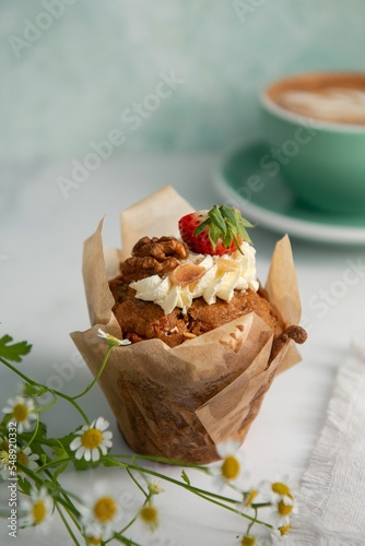 Top view of muffin with cream and fruits