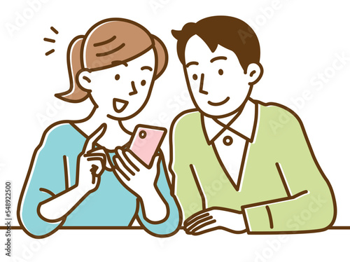 スマホであれこれショッピングする若い夫婦