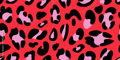 Leopard texture on a pink background. Animalistic seamless pattern. Vector hand-drawn illustration. 