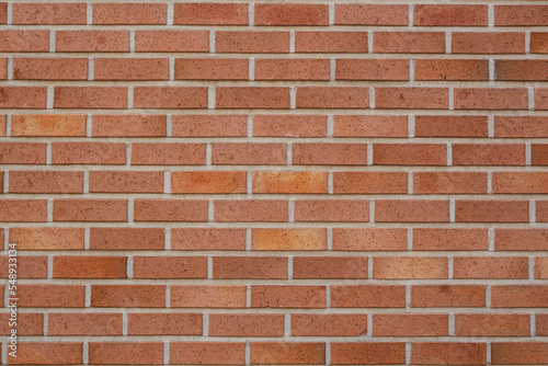 a red brick wall in a residential area