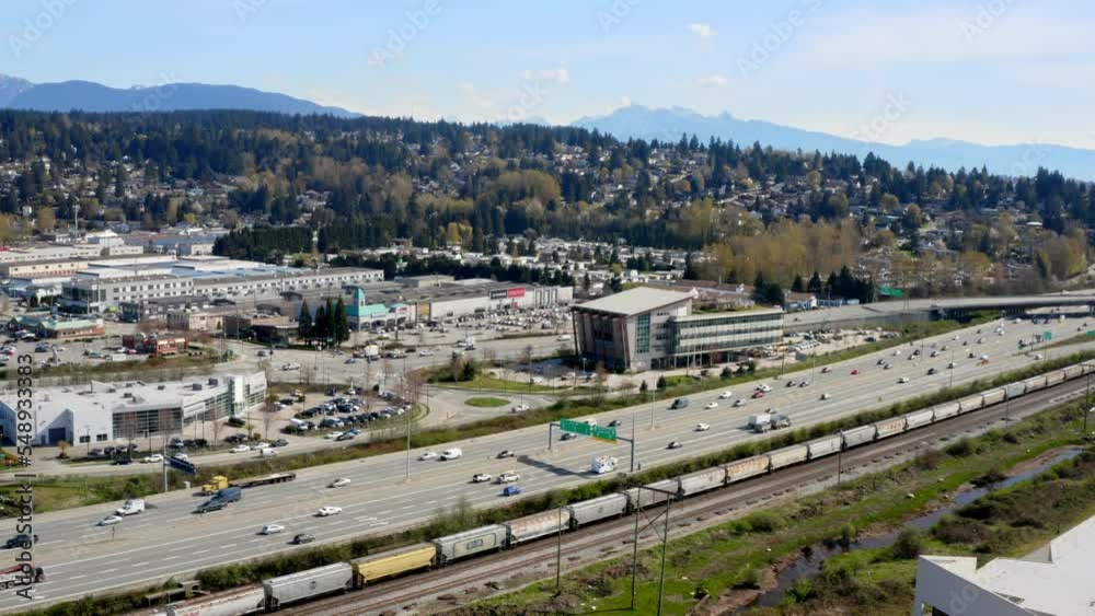 Building Of Transportation Management Centre Along Trans-Canada Highway In Coquitlam, BC, Canada. aerial pan right Building Of Transportation Management Centre Along Trans-Canada Highway In Coquitlam, BC, Canada. aerial pan right