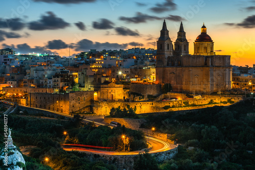 Il-Mellieha, Malta - Beautiful panoramic skyline view of Mellieha town after sunset with Paris Church © marcin jucha