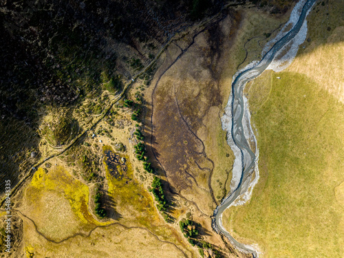 Aerial view of river through alpine highlands in autumn, Nassfeld, Sportgastein, Salzburg, Austria photo